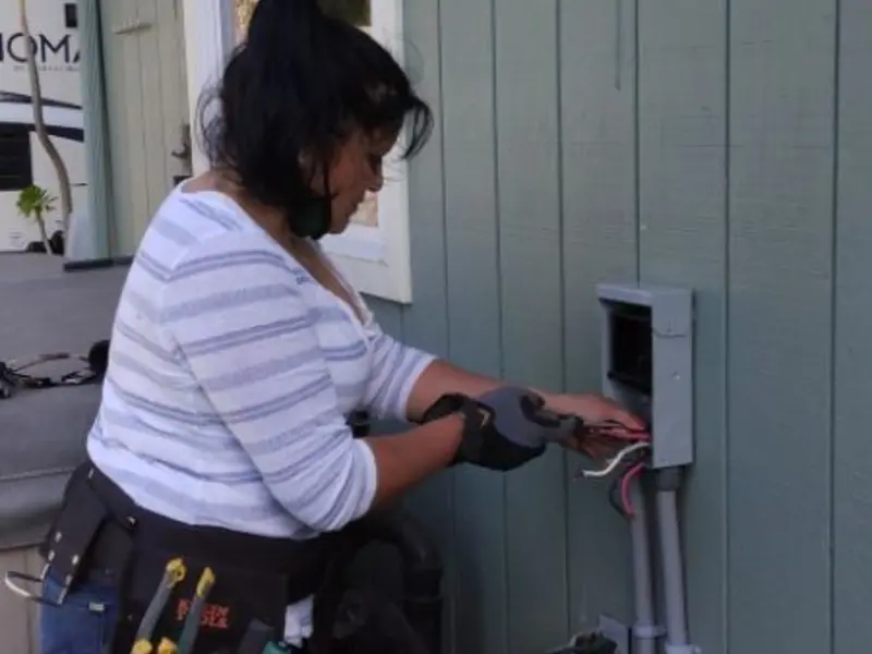 Licensed electrician wiring an exterior subpanel in Nevada